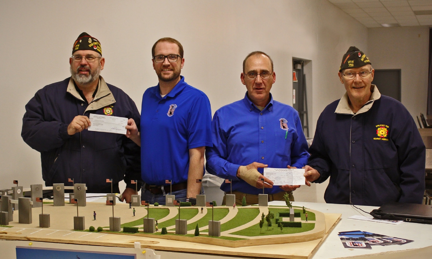 Jim Lutz, Cdr District 13, presets Alex Straatmann a check for $1,000 from the district, and John Kruse, Cdr Post 759 presents a check for $5,000 from the VFW Department of Nebrska.  All of these monies go to help build and support the Central Nebraska Veterans Memorial